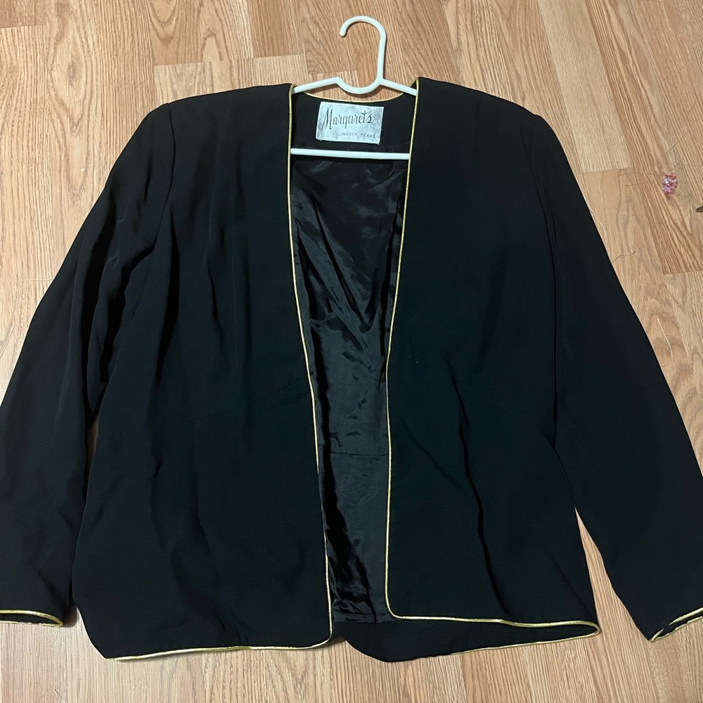 Elegant black blazer with gold lining
